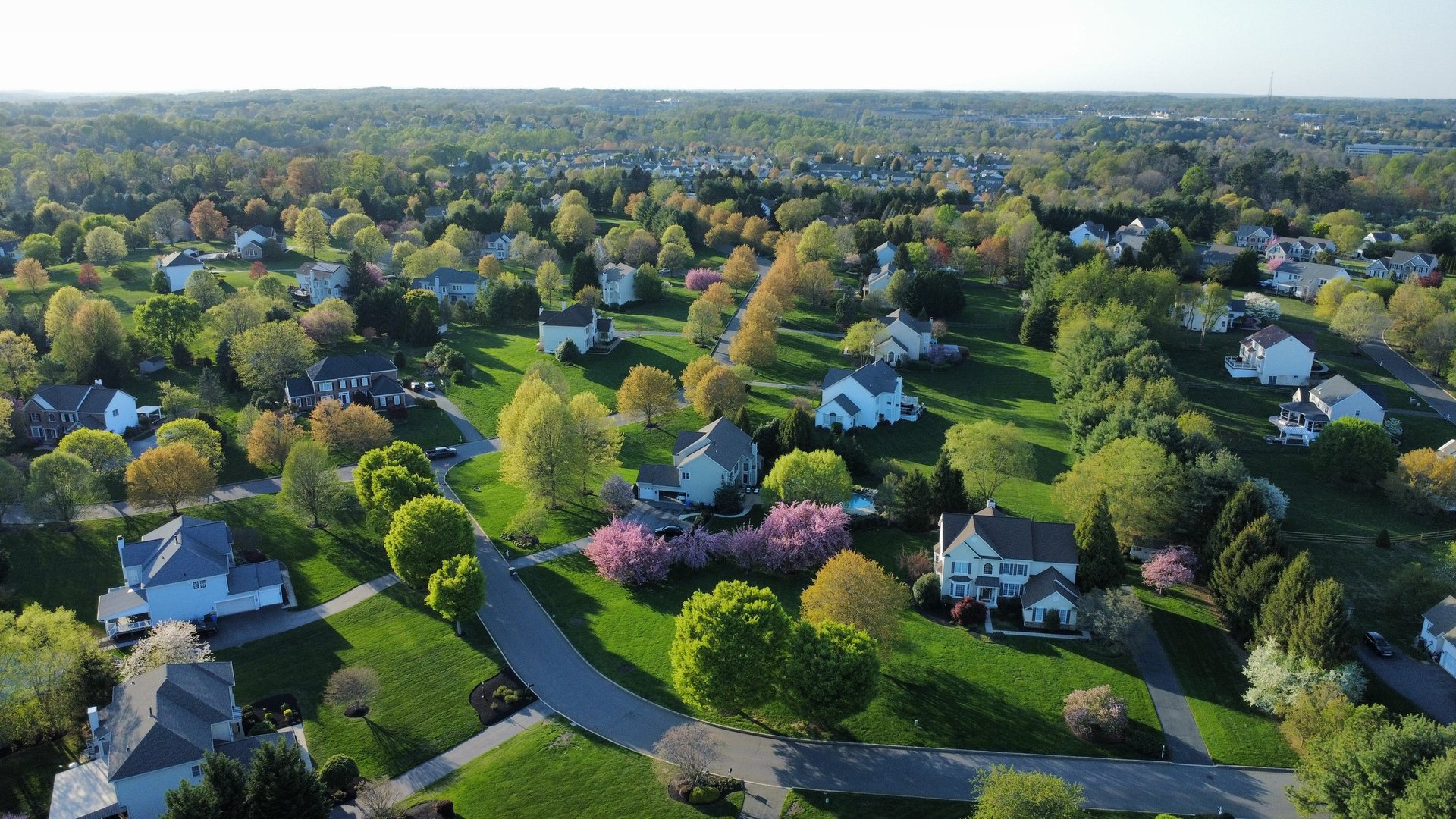 Aerial view of residential community with beautiful homes and landscaping